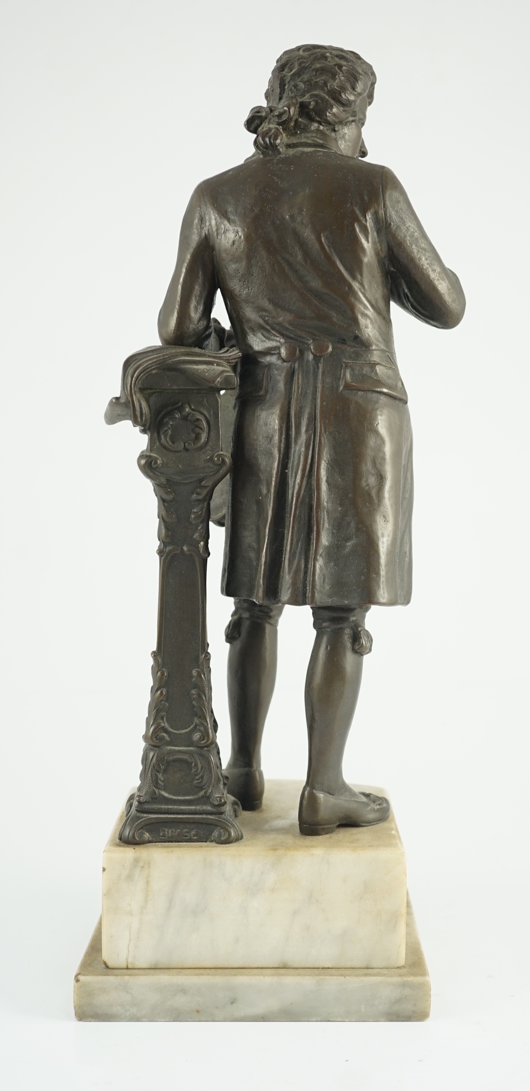 Carl Brose (German, 1880-). An early 20th century bronze figure of Mozart holding a violin, 41cm high